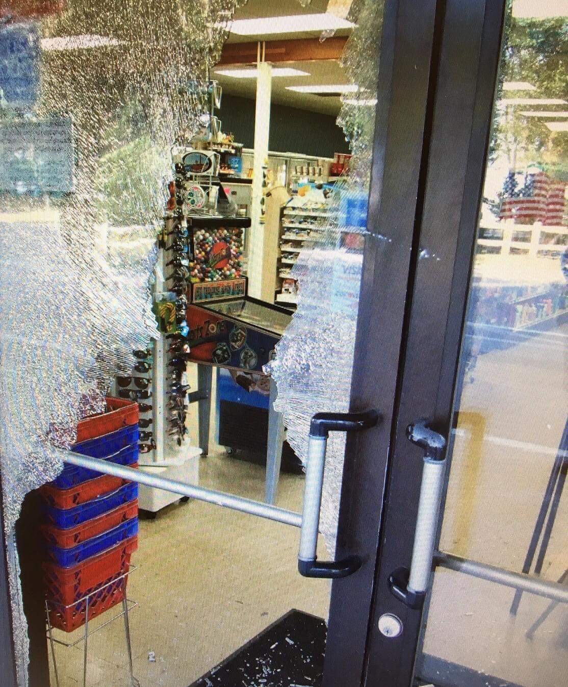 Man throws brick through store’s glass door to steal booze