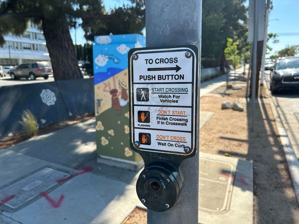 Does pushing the walk button more than once change the traffic signals