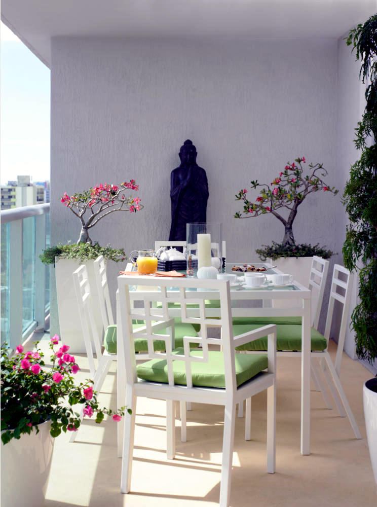 Buddha statue on the balcony with white furniture Interior Design