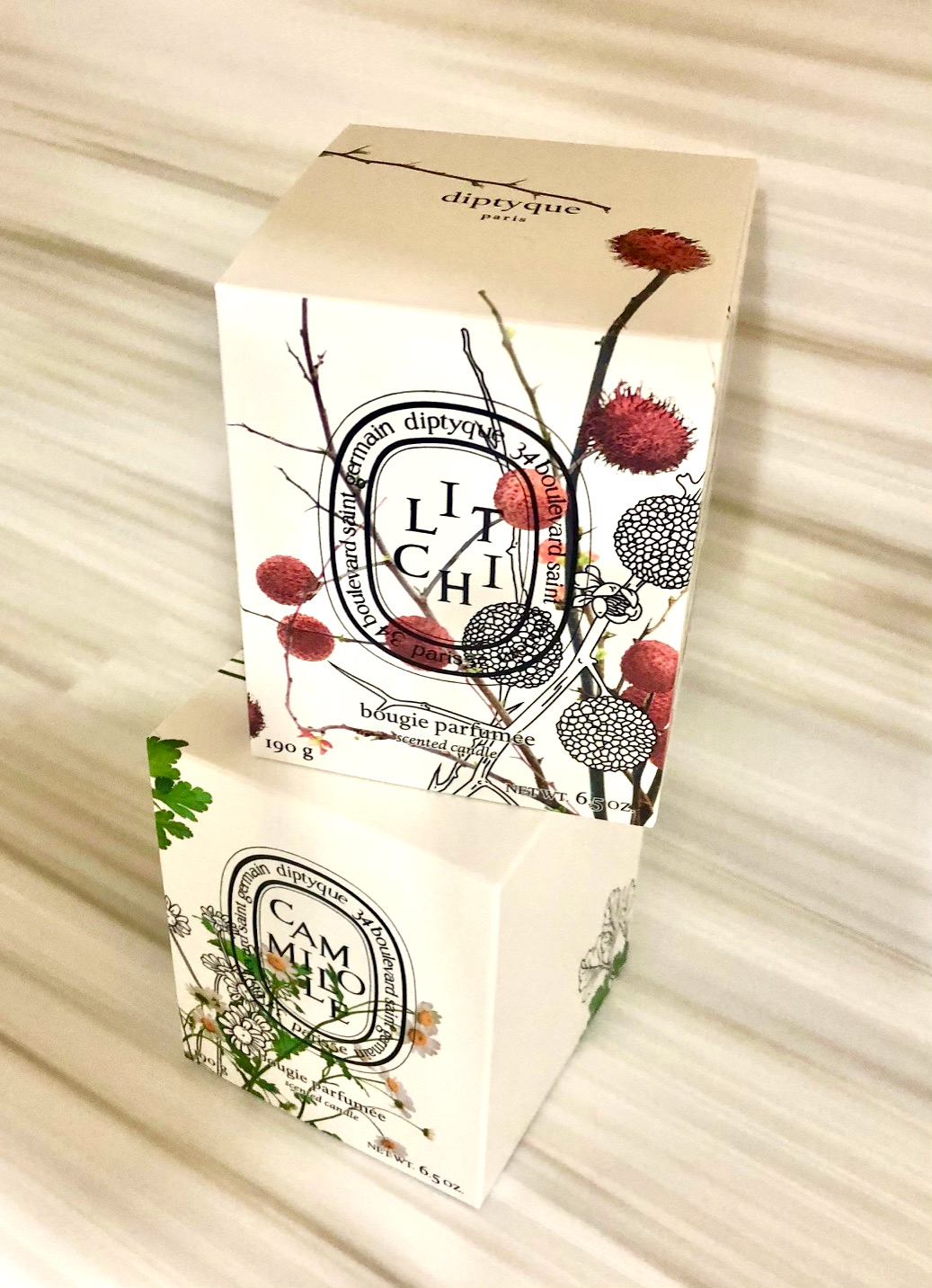 Diptyque Chamomile and Litchi Limited Edition Candles of the comely