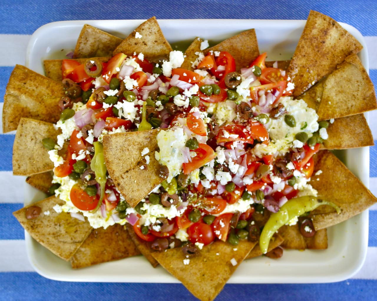 Greek Style Nachos with Spicy Whipped Feta Olive Tomato