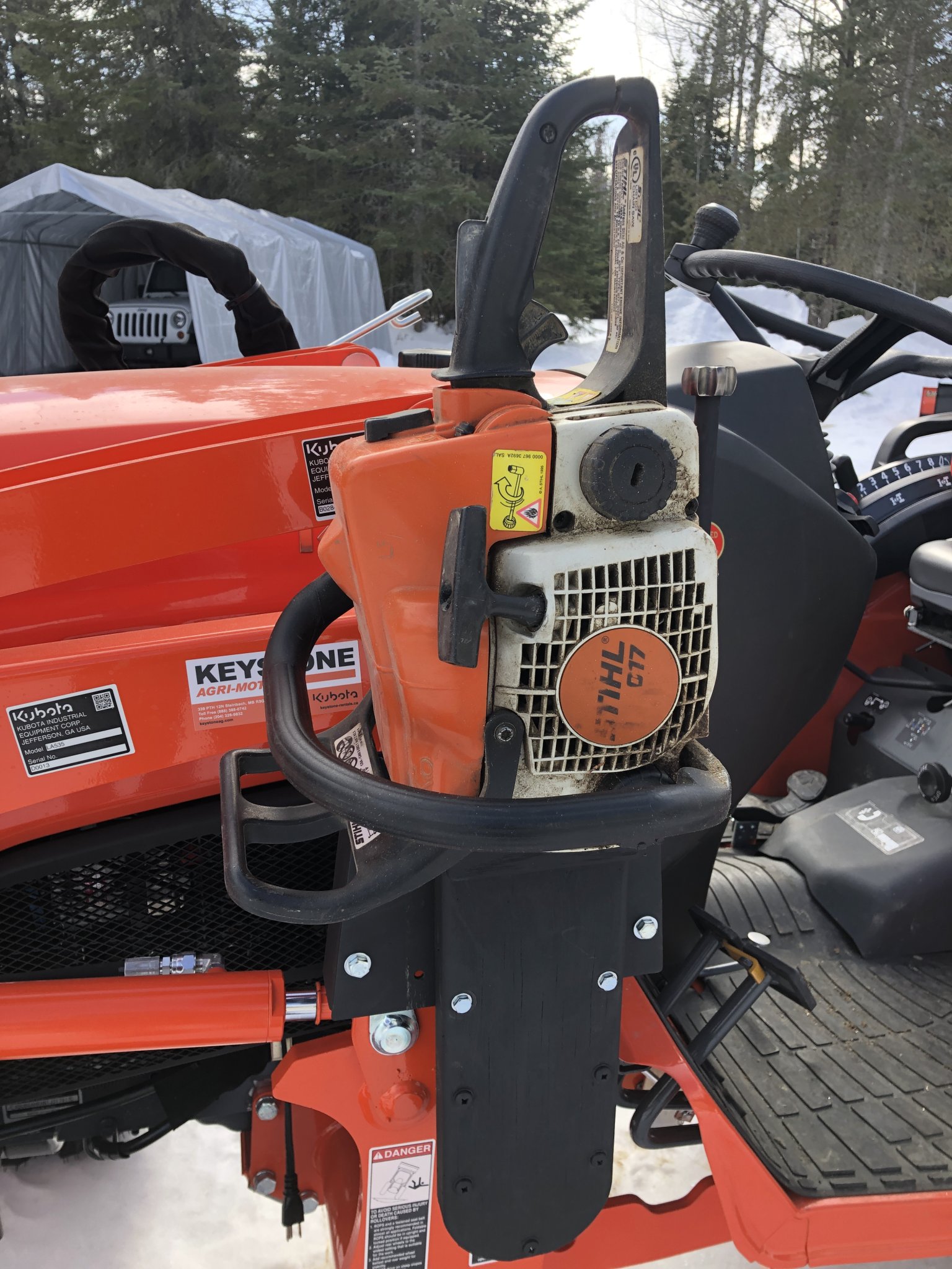 Chain saw mount on my Lx2610, one of a few things I've done...so far