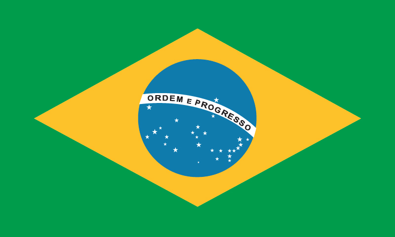 A blue disc depicting a starry sky within a yellow rhombus, on a green