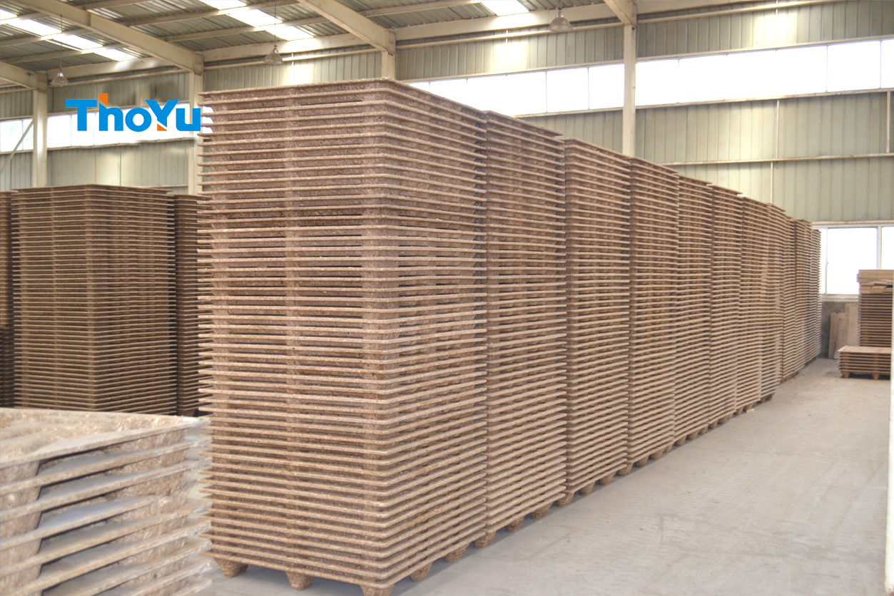 press wood pallets made of wood waste, shavings, logs, recycled and shaving