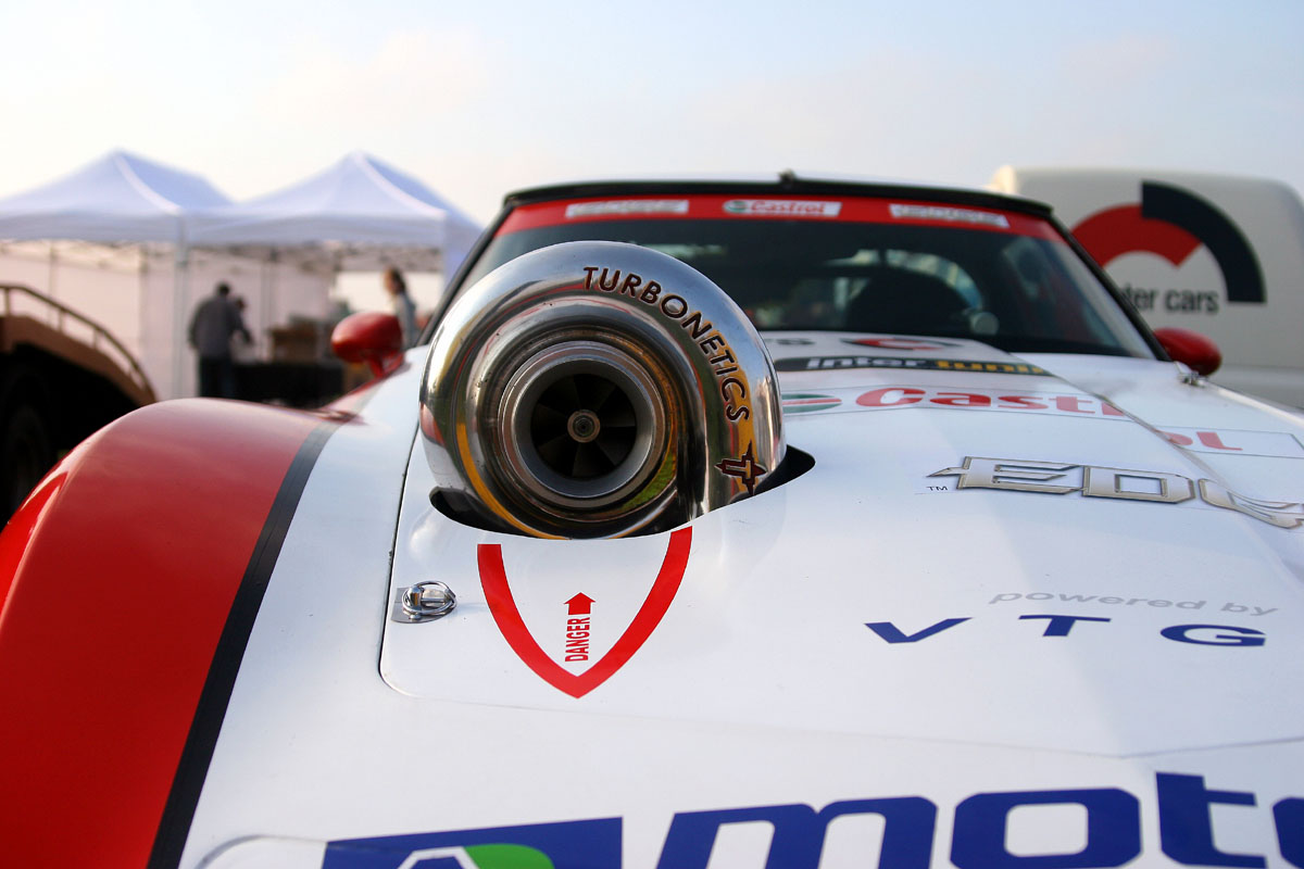 Show me turbos/engines/blowers sticking out of the hood