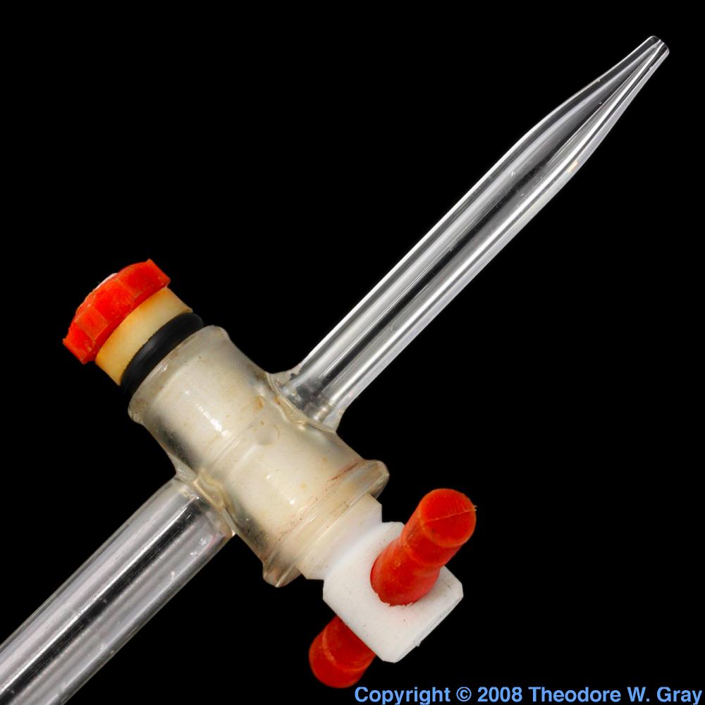 Teflon burette stopcock, a sample of the element Fluorine in the