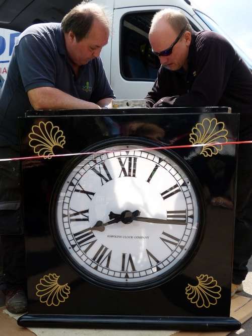 Installation of the new clock at Palmers Green Triangle Palmers Green