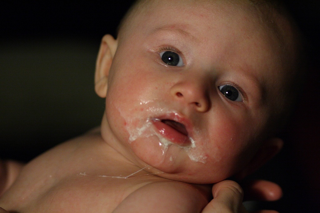 my baby spits up breast milk more than formula