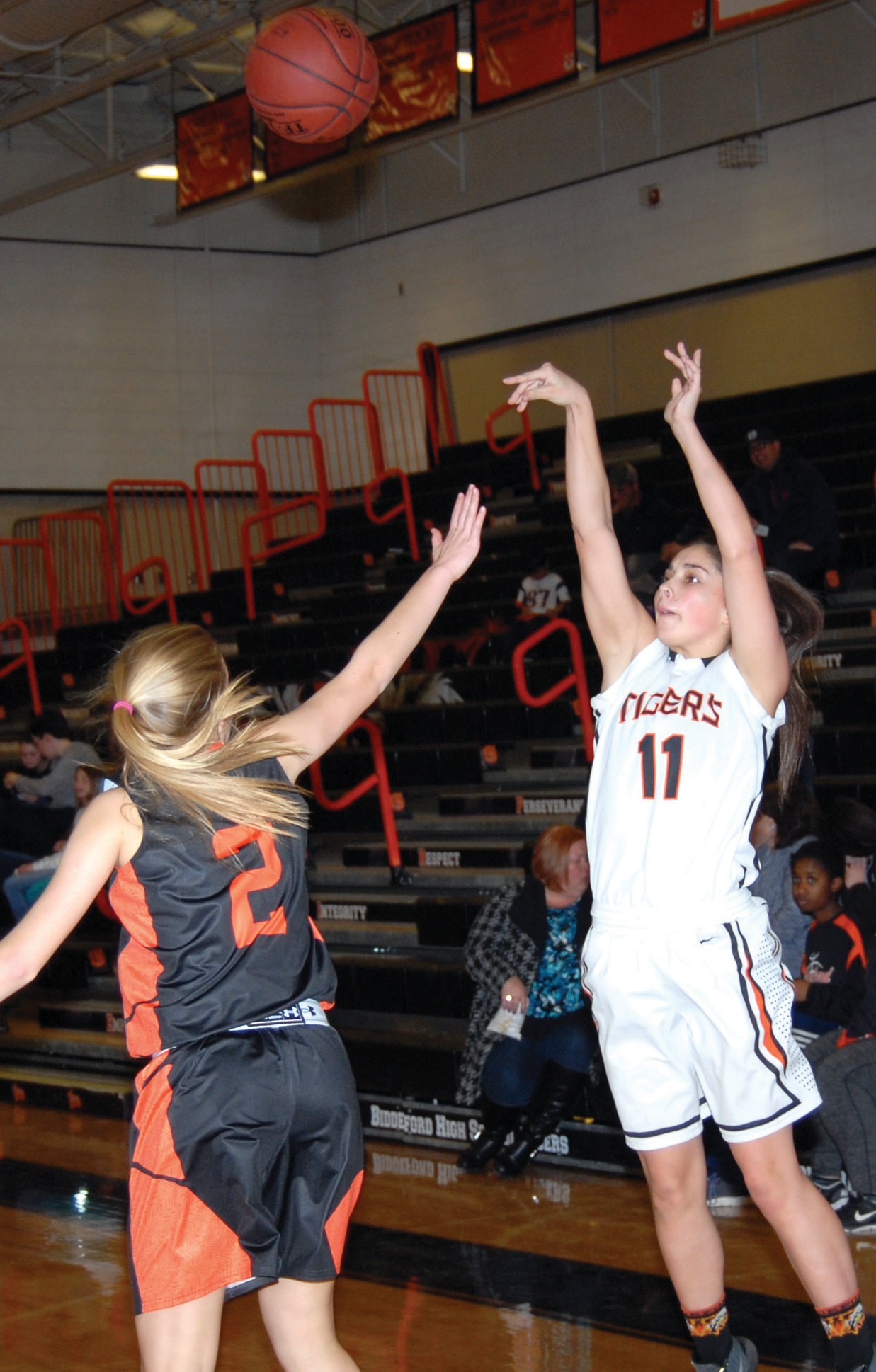 Biddeford’s Brittany Roy fires a 3-pointer against Brunswick on Friday. Roy finished with a team-high 15 points.