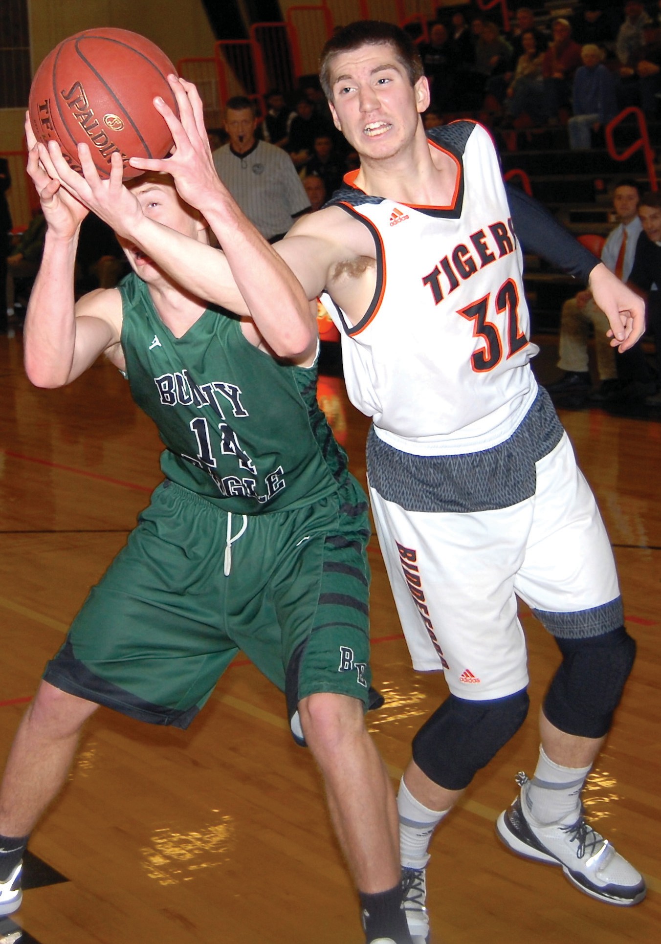 Biddeford’s Caleb Ball battles Bonny Eagle’s Eben Kittredge-Cram during Wednesday’s game.