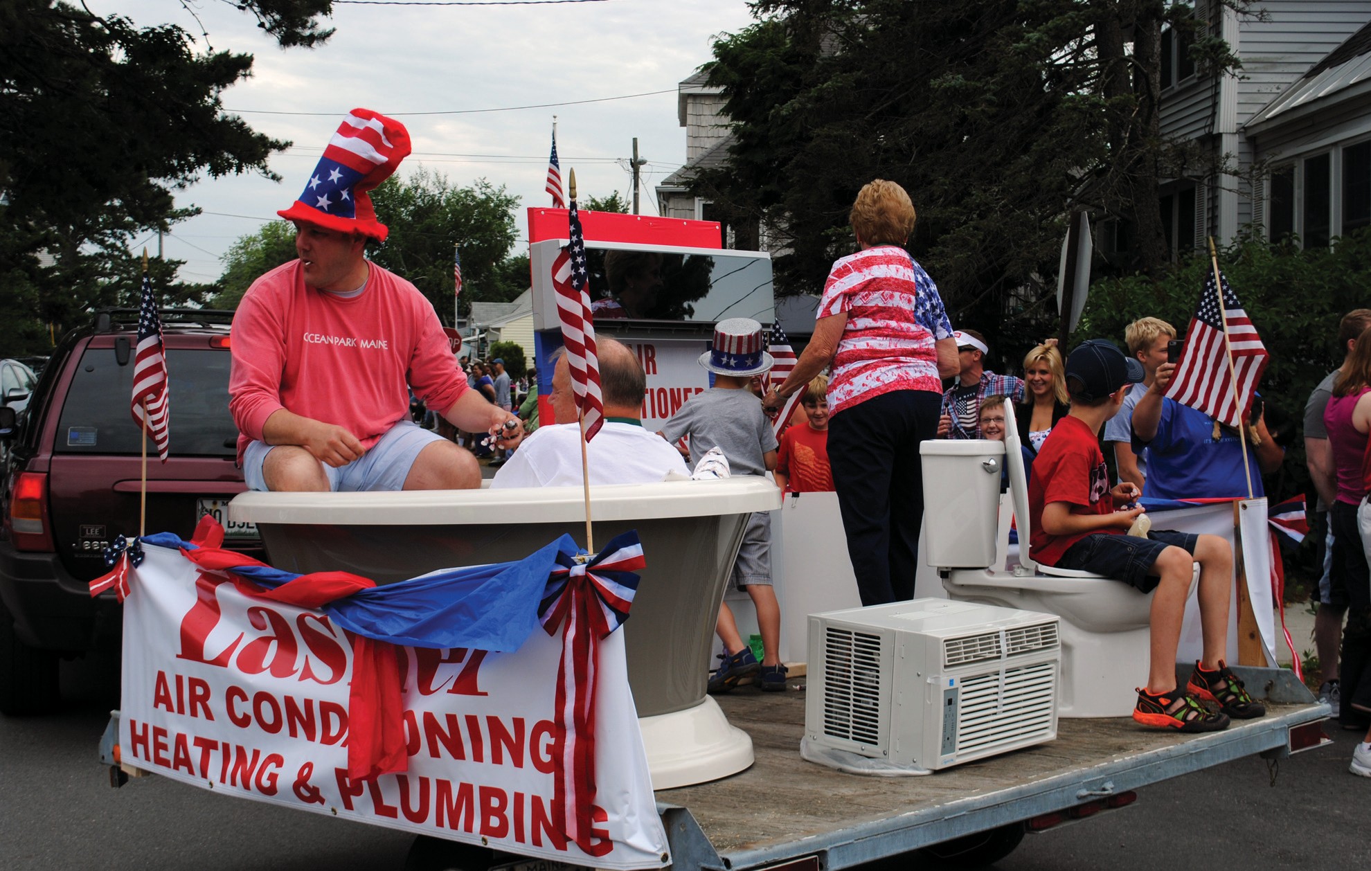 A float from Lasher Plumbing and Heating adds a little humor to the Ocean Park Fourth of July 2015 parade.