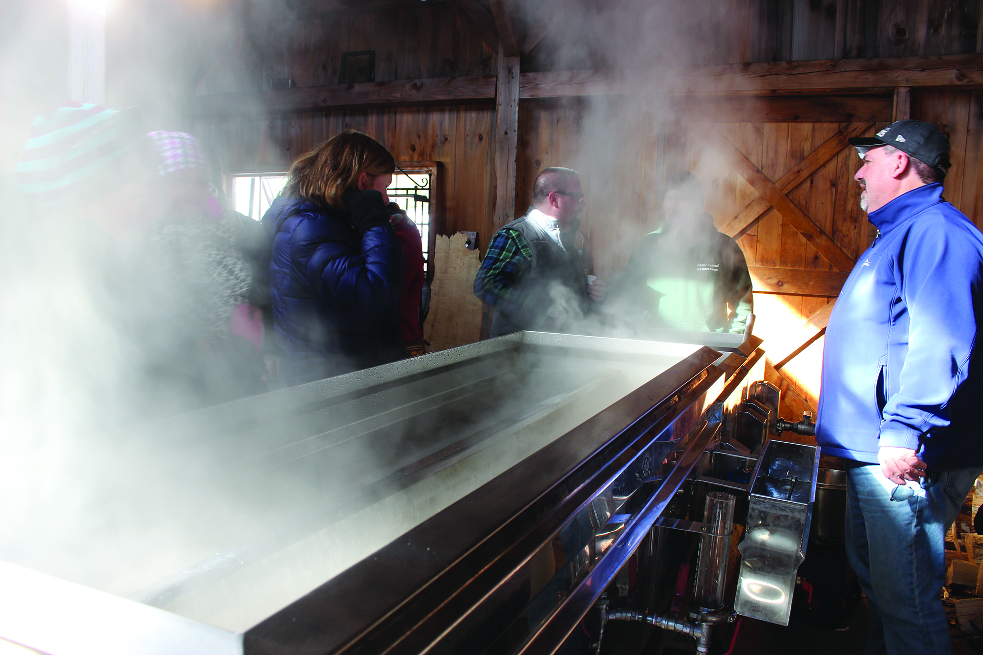 Sap boils in the evaporator at the Harris Farm sugarhouse on Sunday. RYDER SCHUMACHER/JournalTribune