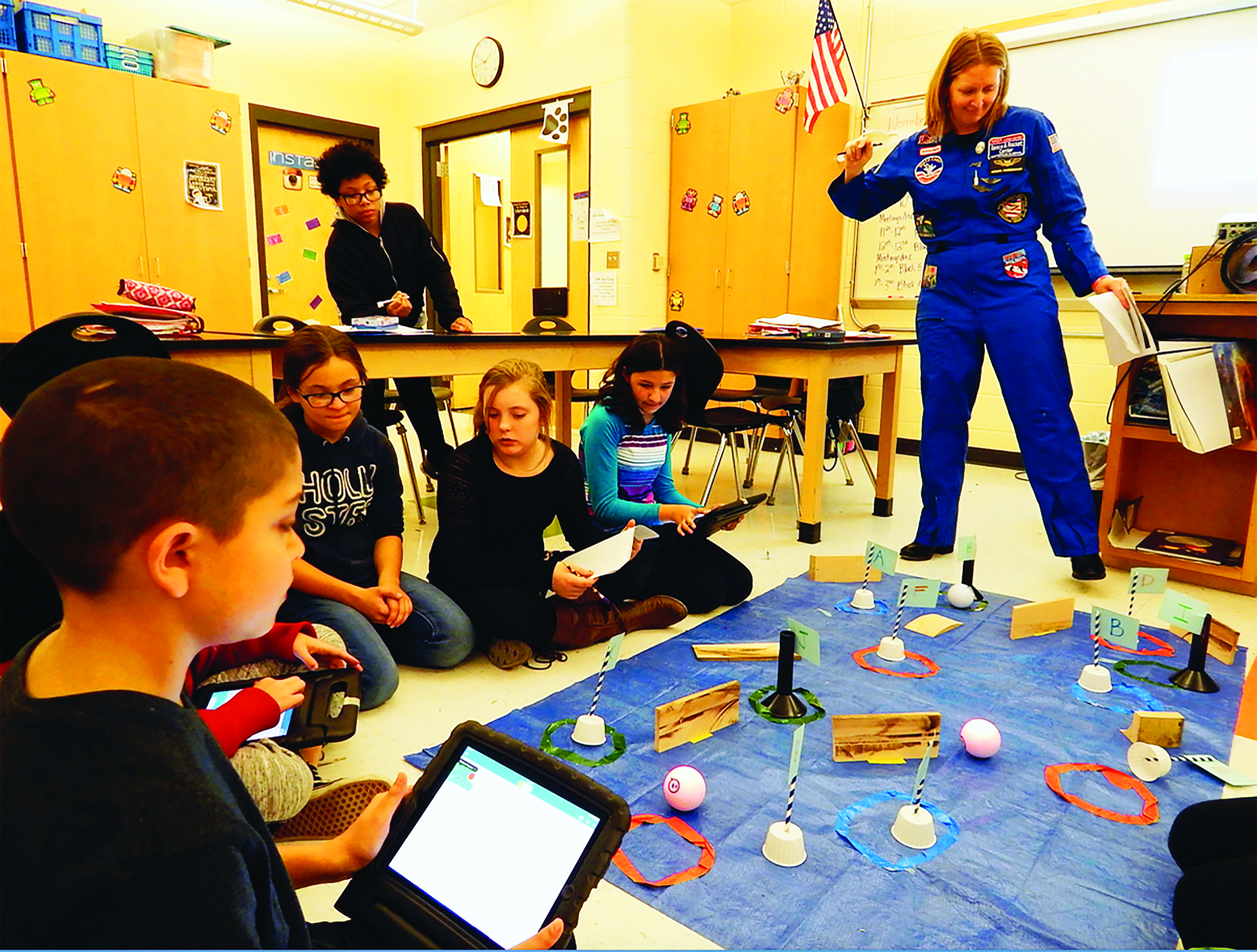 Robotics teacher Meredith Swartzendruber leads Biddeford Middle School students through a lesson that had them program and operate robots to navigate the surface of Mars. ED PIERCE/Journal Tribune
