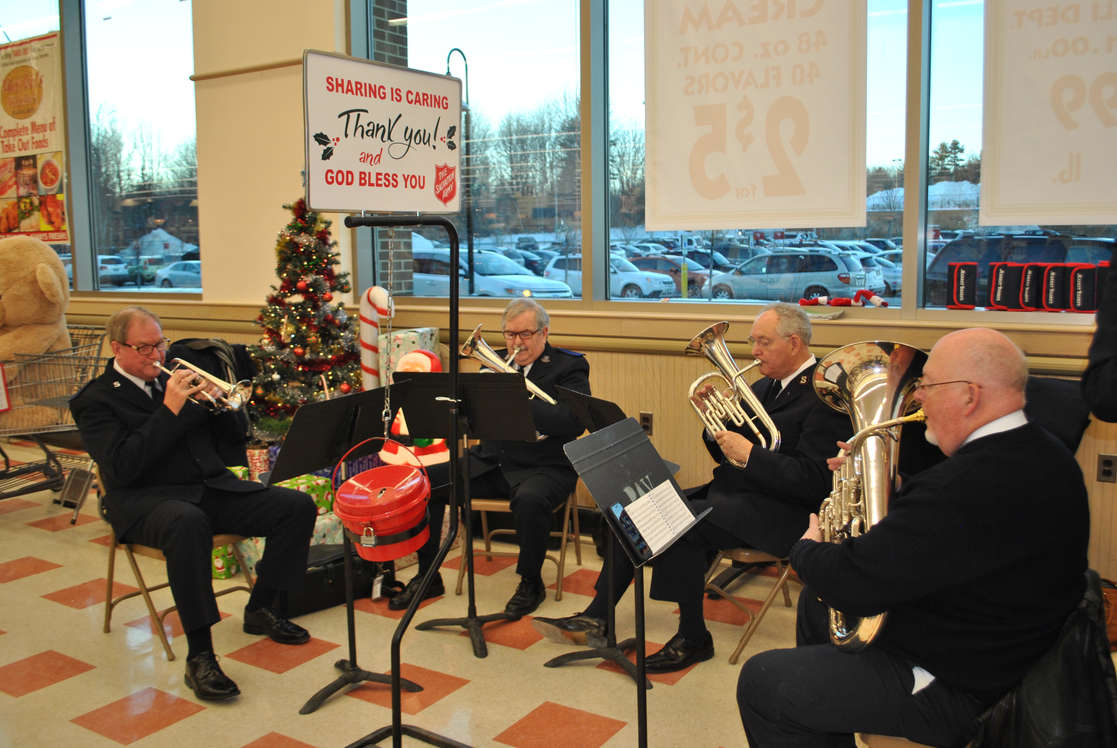 A brass ensemble from the Old Orchard Beach Salvation Army plays at the Market Basket grocery store in Biddeford on Thursday. LIZ GOTTHELF/Journal Tribune