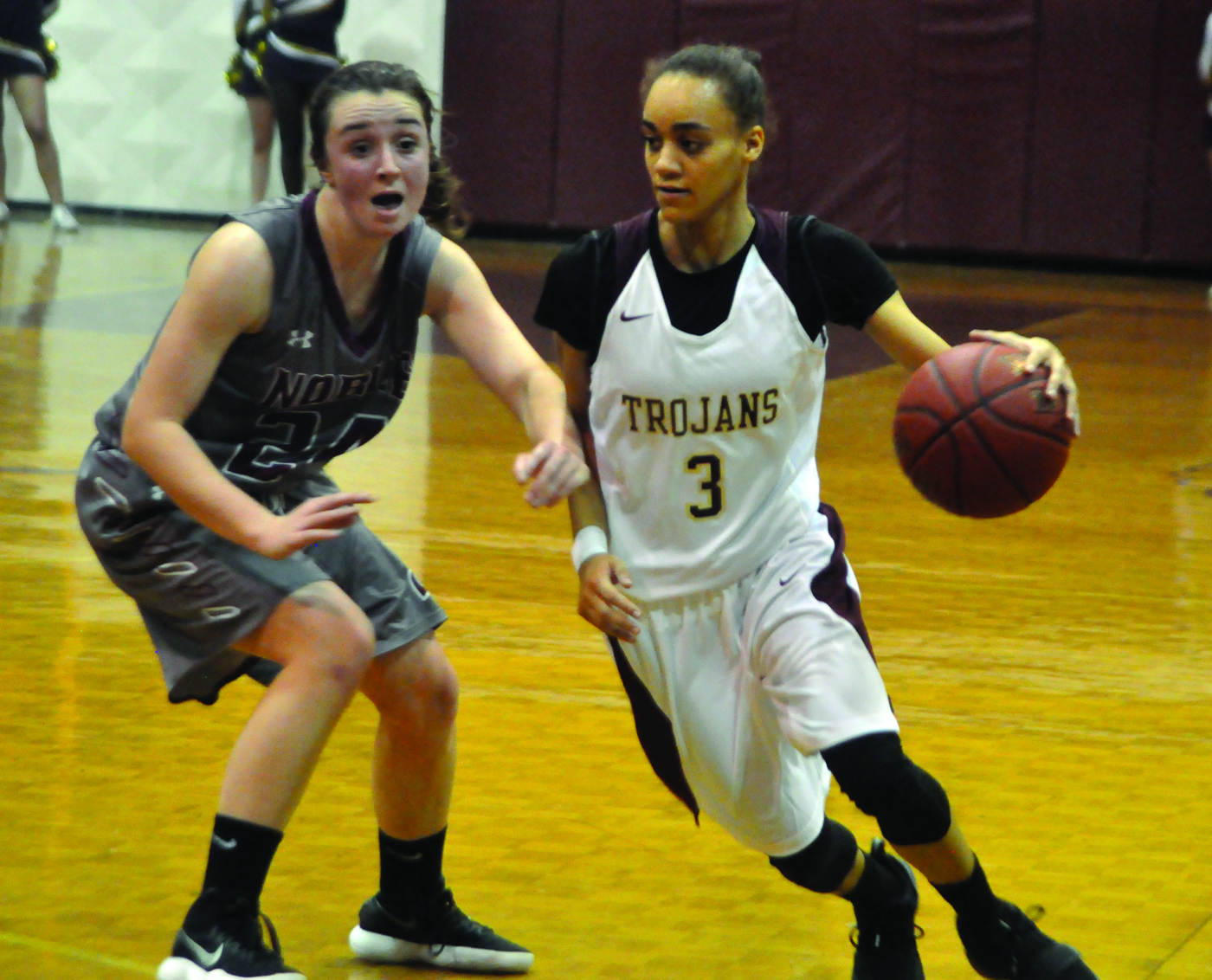 Thornton Academy’s Alex Hart works past Noble’s Amy Fleming in the fourth quarter on Wednesday. ALEX SPONSELLER/ Journal Tribune