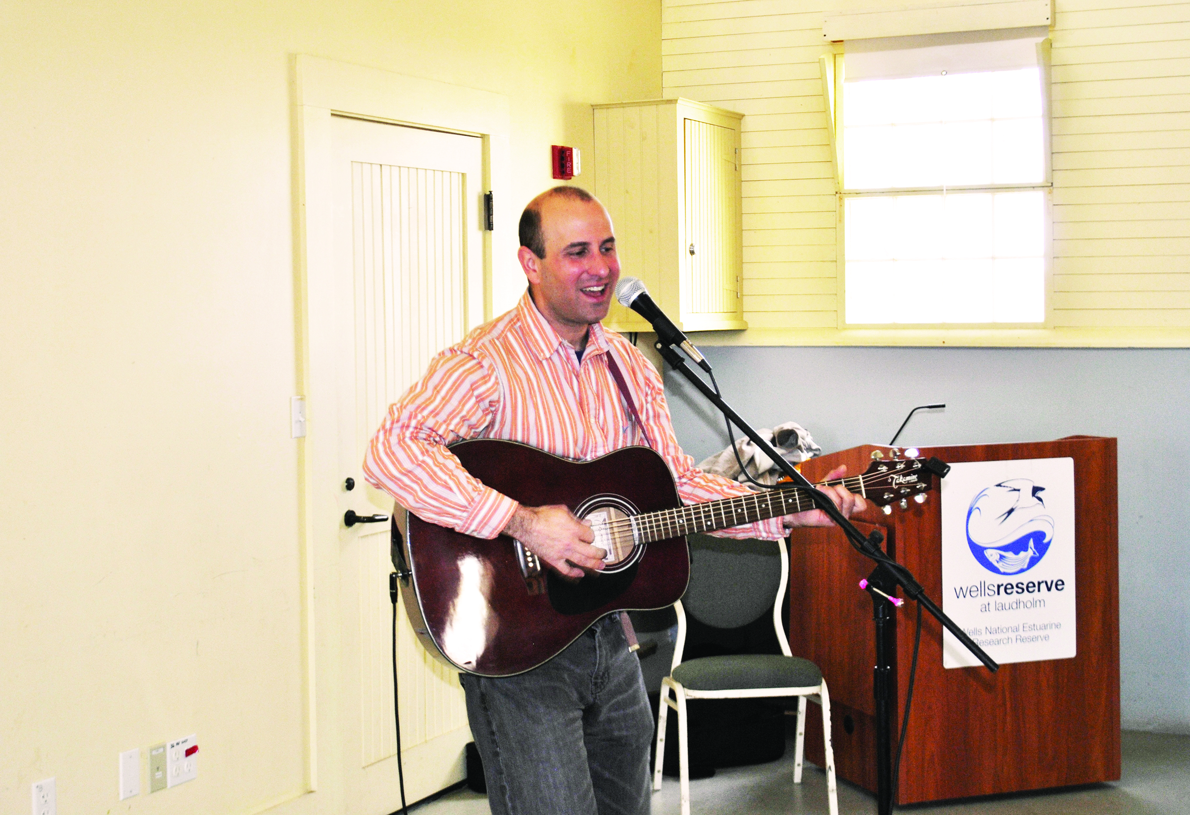 Matt Loosigian sings songs promoting environmental stewardship at an Earth Day celebration at Wells Reserve at Laudholm on Friday morning. LIZ GOTTHELF/Journal Tribune