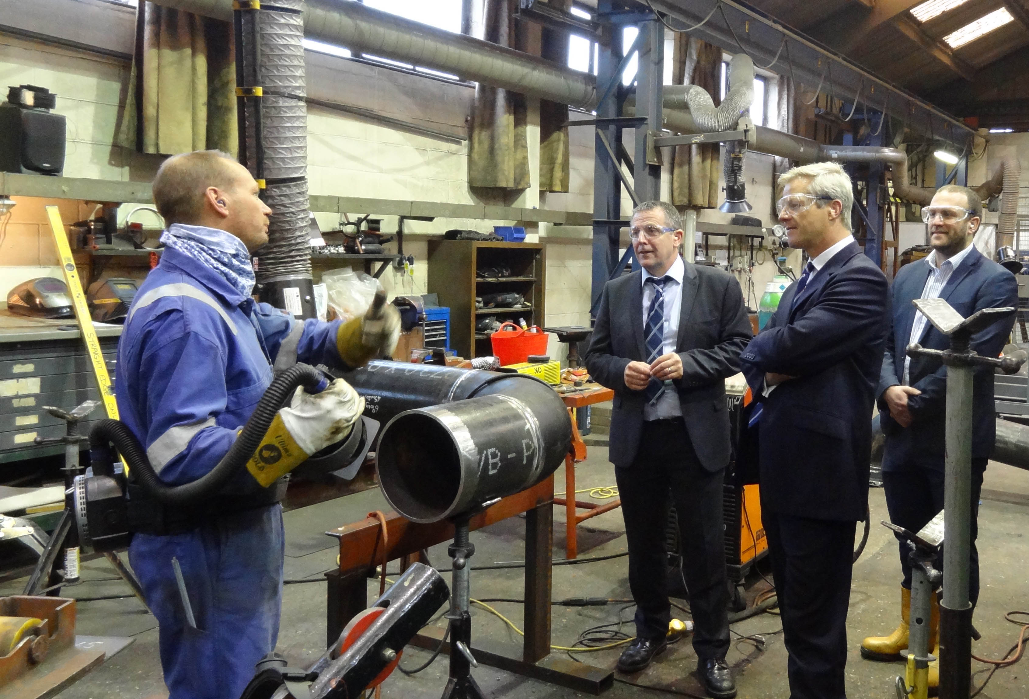 Chris Claydon (centre right) discussing the importance of skills and training at Pruce Newman