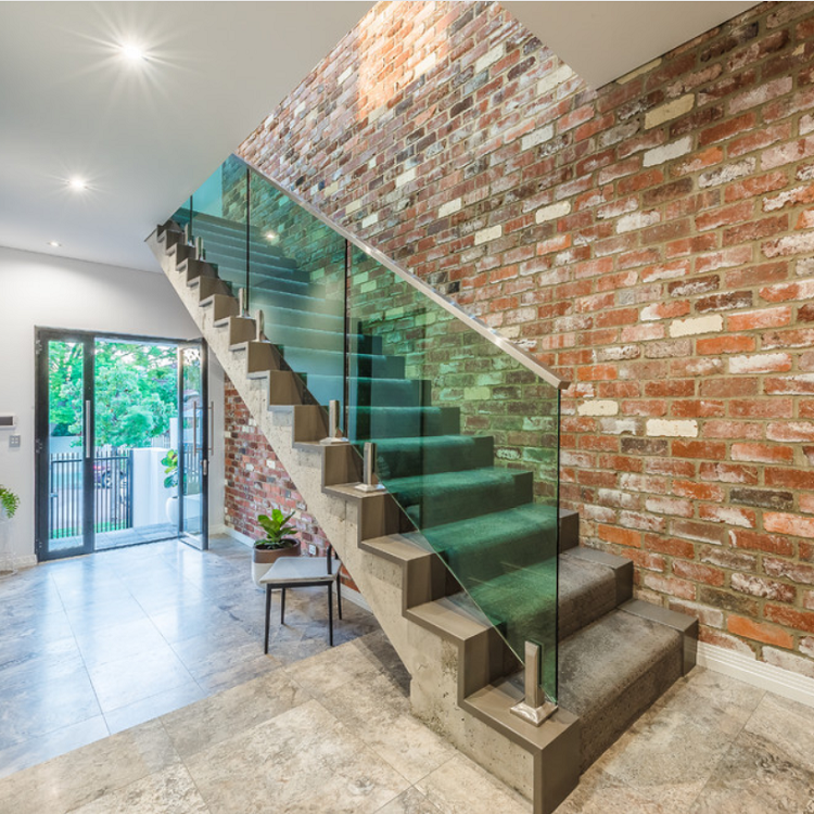 Green tempered glass spigots stair railing indoor