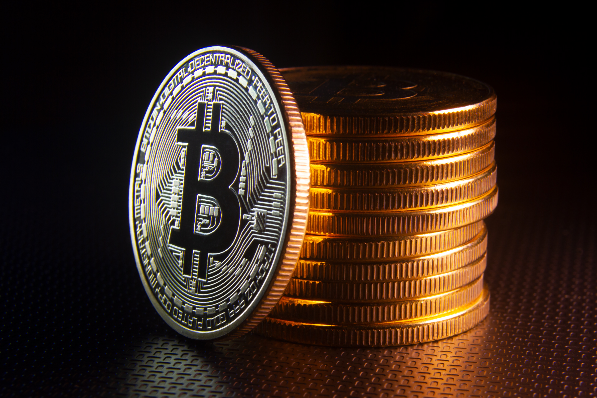 Bitcoin leaning against coin stack free image download