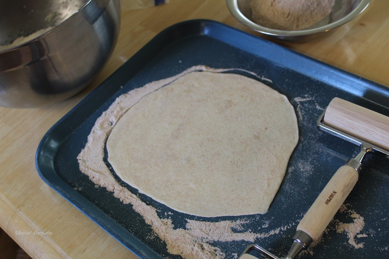 Rolling out shells for homemade enchiladas recipe.