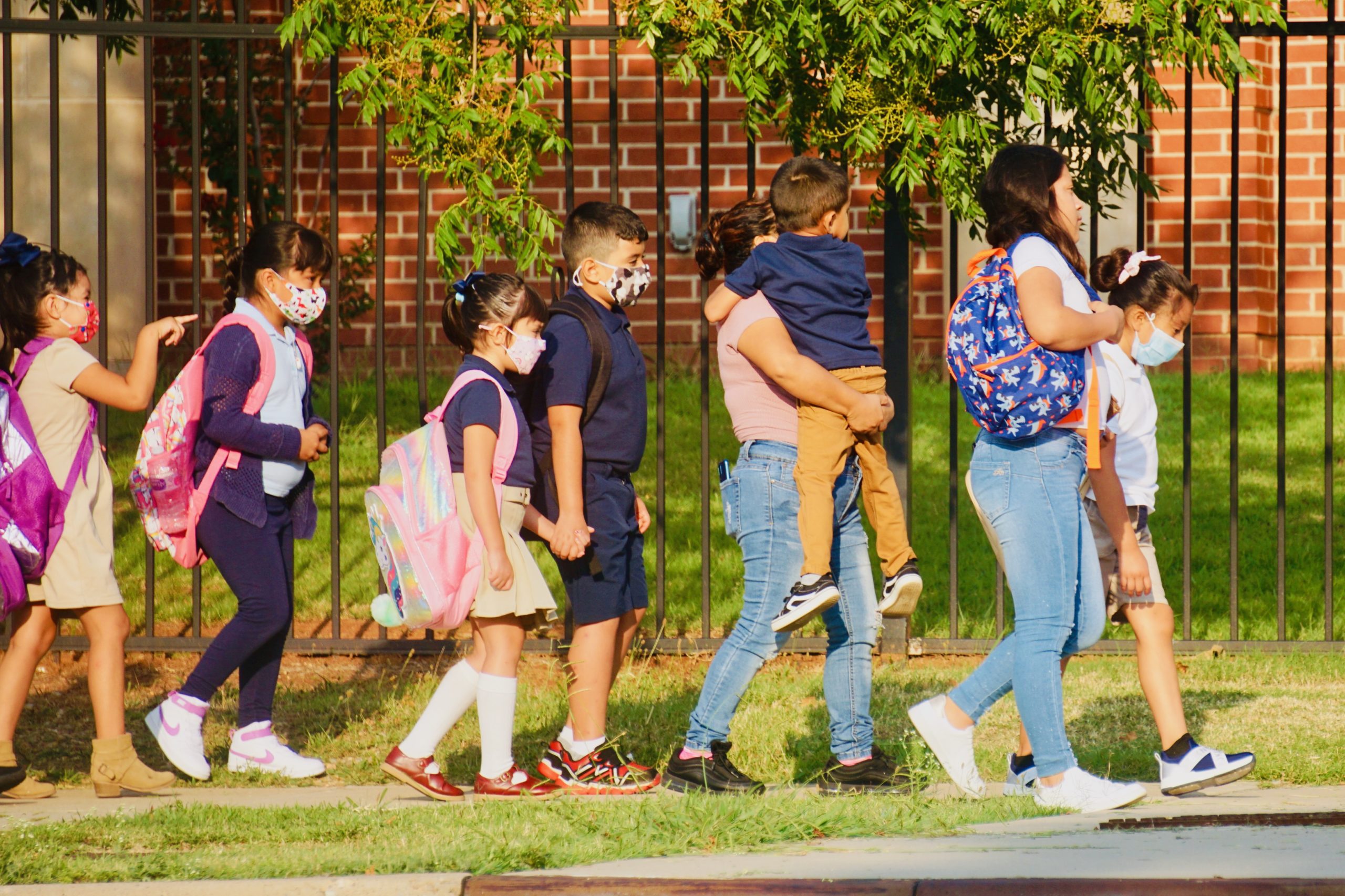 An Oklahoma school system defies law against mask mandate as other