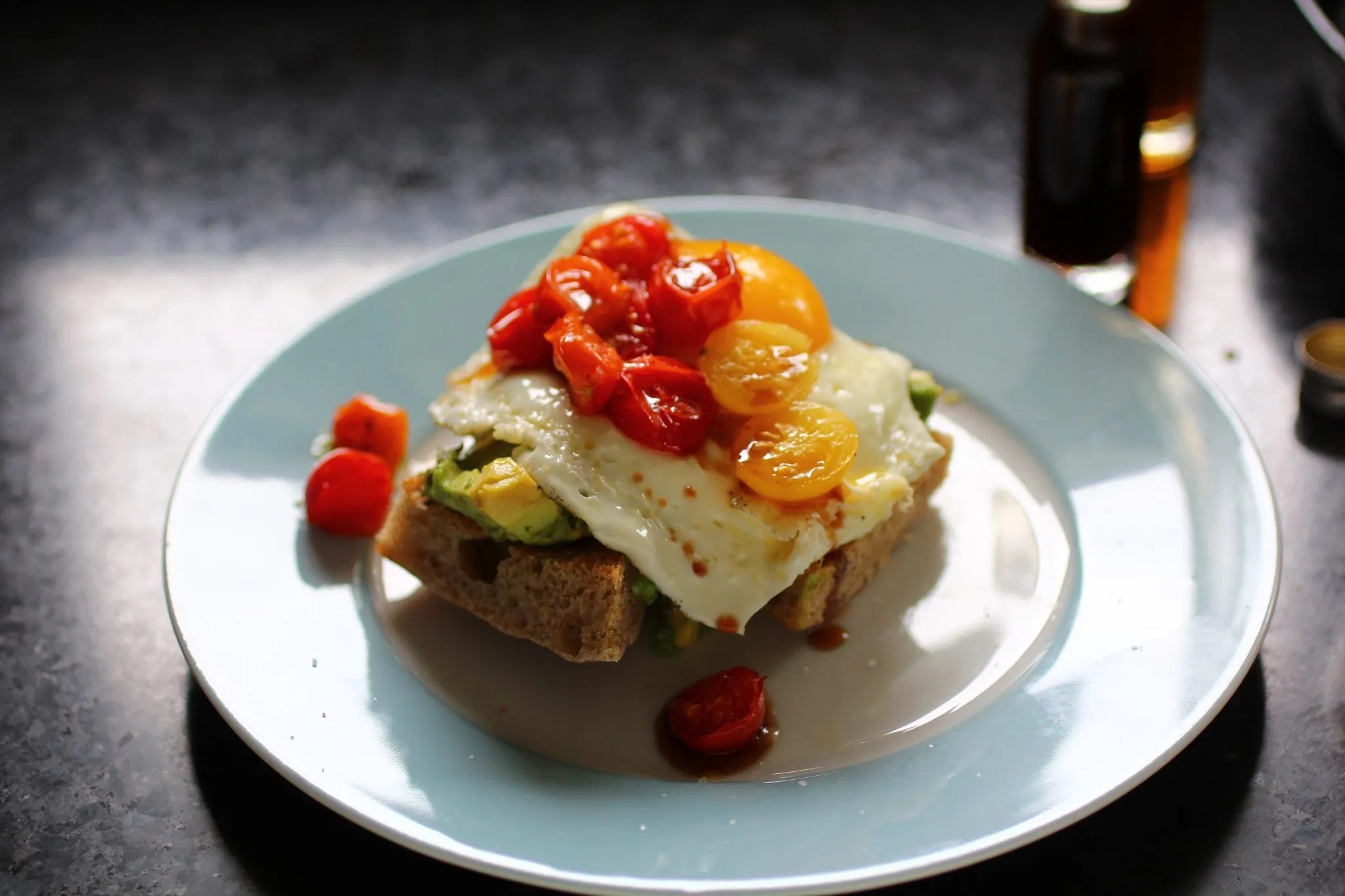 Avocado and Egg Elevated: Avocado toast with broiled tomatoes and date vinegar