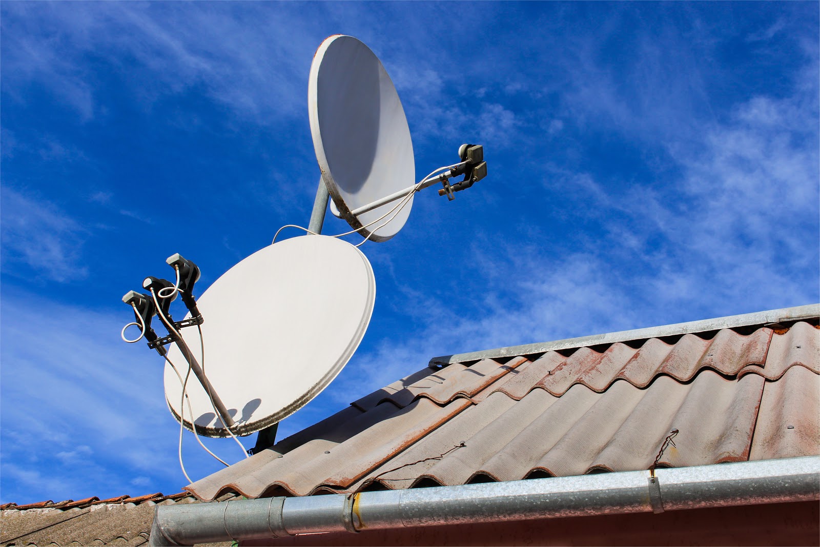 Who is responsible for a communal sky dish?