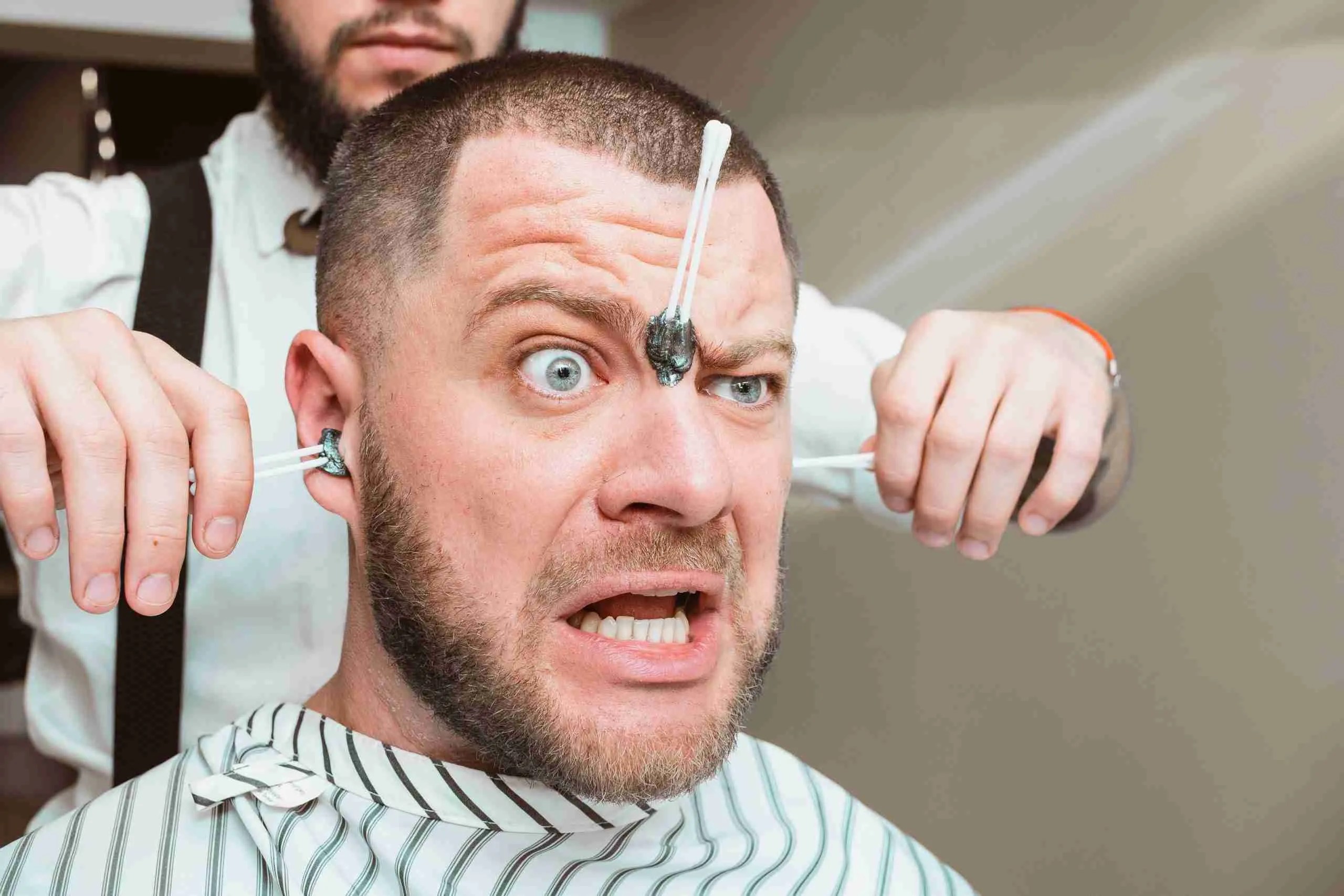 Waxing. Hair removal in the ears. Pulling hair from ears Regional