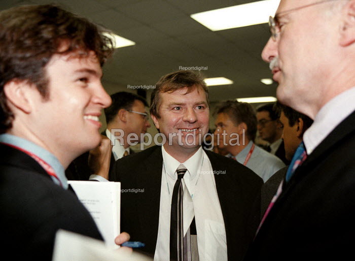 Reportage photo of Charlie Whelan Press Officer taking to Journalists