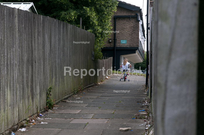Reportage photo of A girl on a bicycle, Druids Heath, Birmingham 25 Jul
