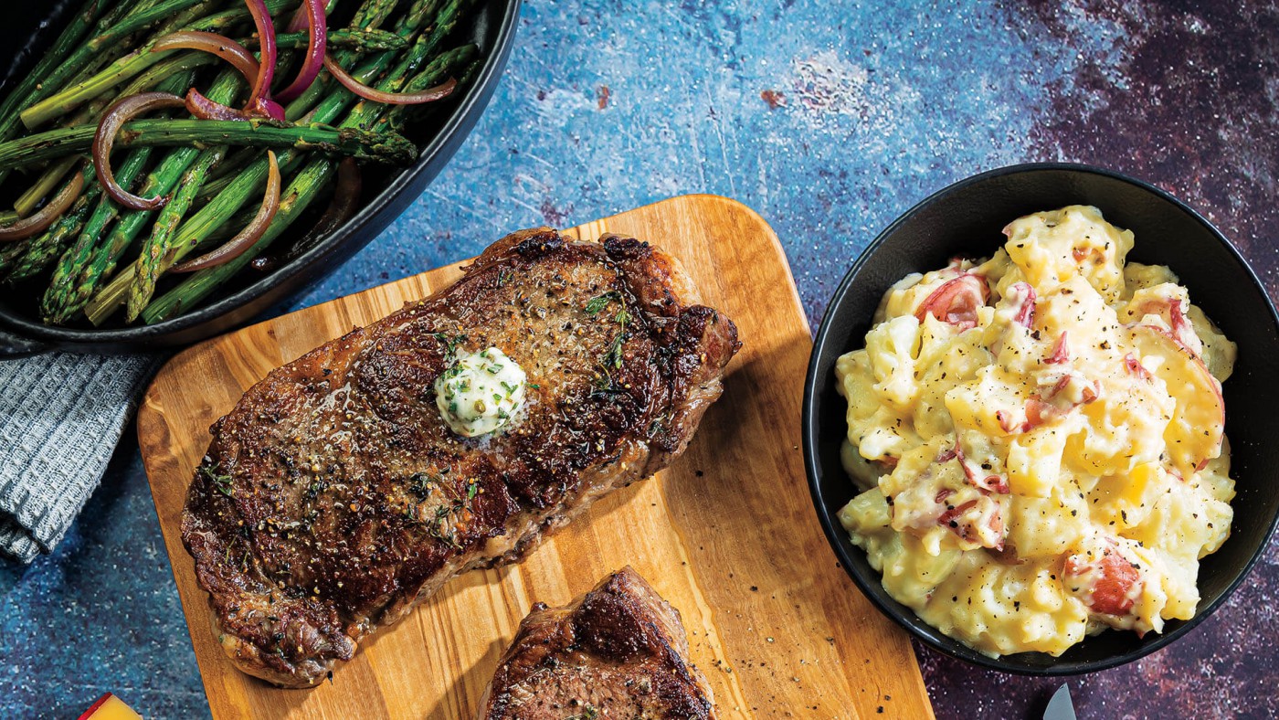 PanRoasted Strip Steaks with Gouda Smashed Redskins & Asparagus