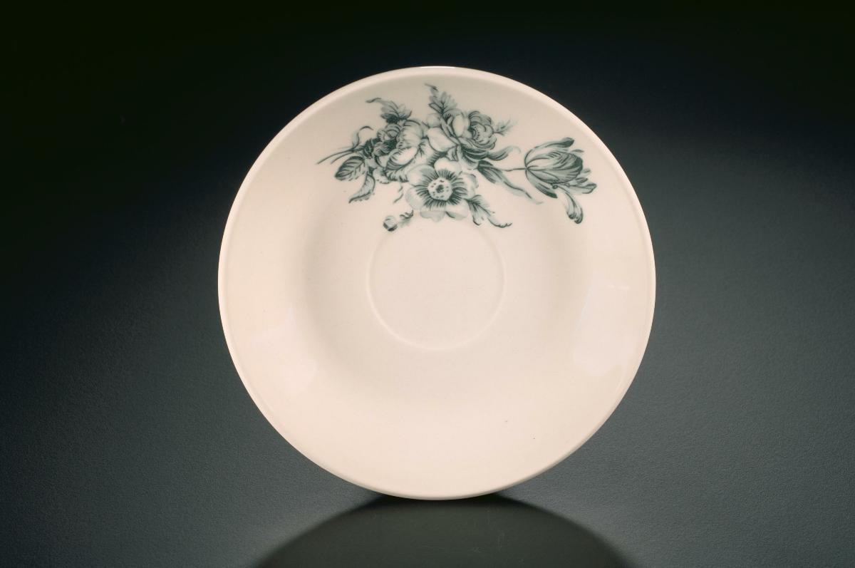 Kopitiam cup and saucer with brown 'bunga raya' (hibiscus) motif