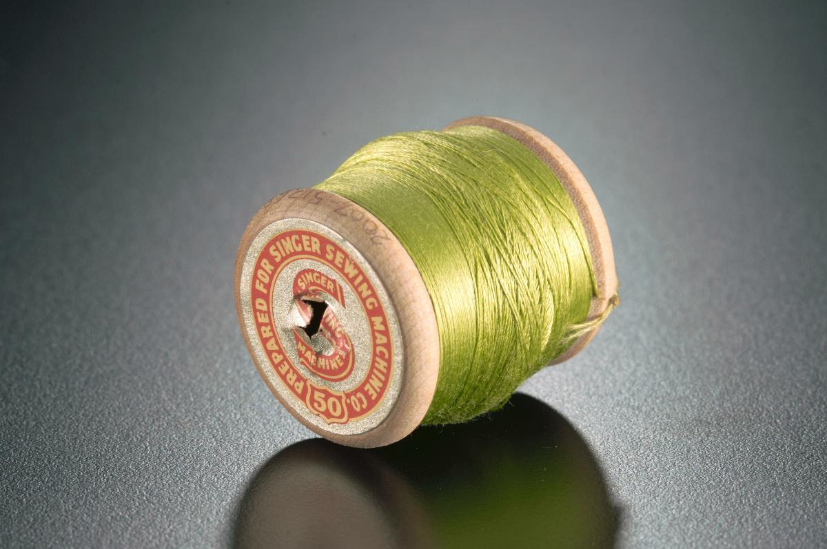 A spool of machine thread for Singer sewing machines