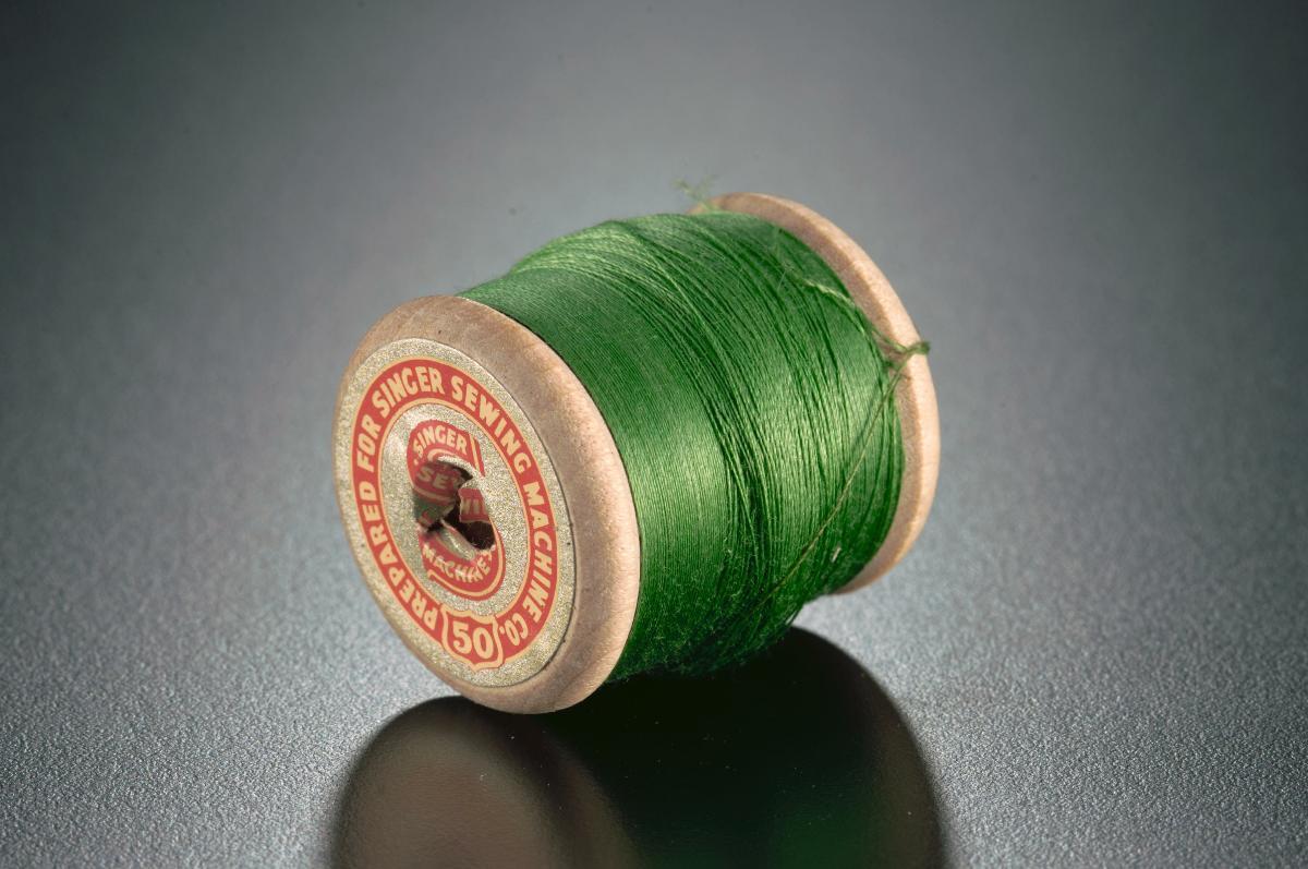 A spool of machine thread for Singer sewing machines