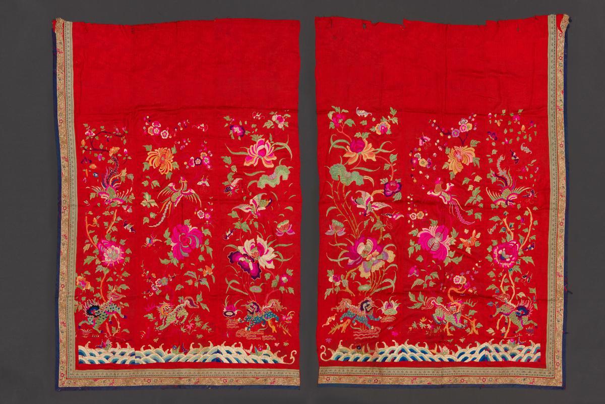 A pair of embroidered curtains for the bridal bed