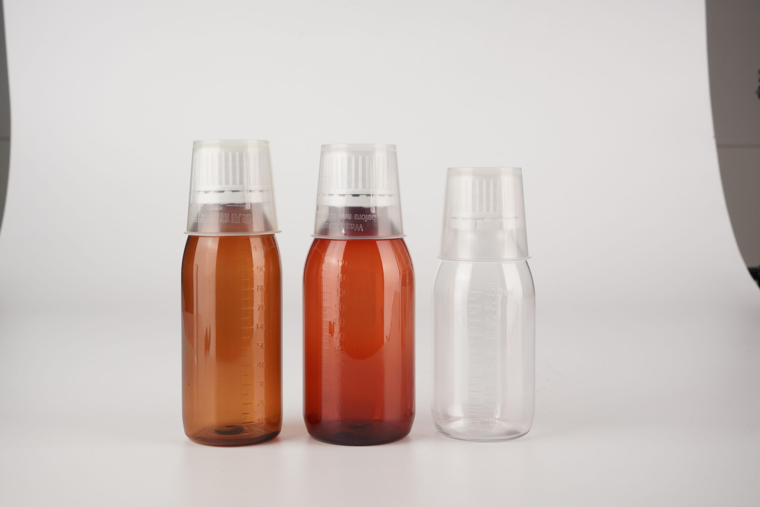 Wholesale Amber/Clear Plastic Bottles with Measuring Cup for Liquid