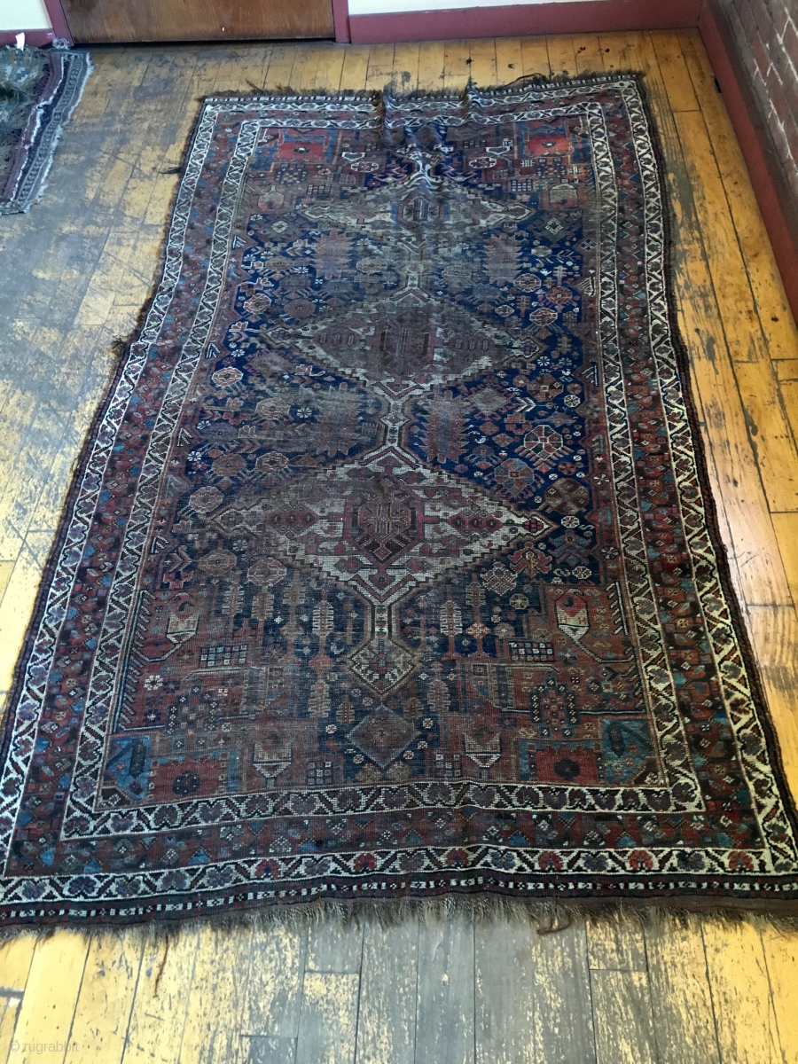 Back room storage clean out. Old South Persian rug. Dirty, worn