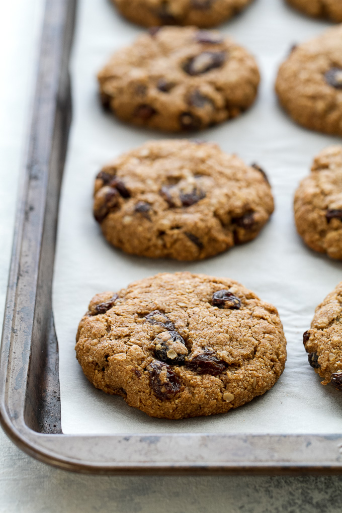 Soft & Chewy Flourless Oatmeal Raisin Cookies running with spoons