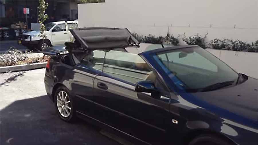 How to put a top up and down Manually on a Saab 93 Convertible?