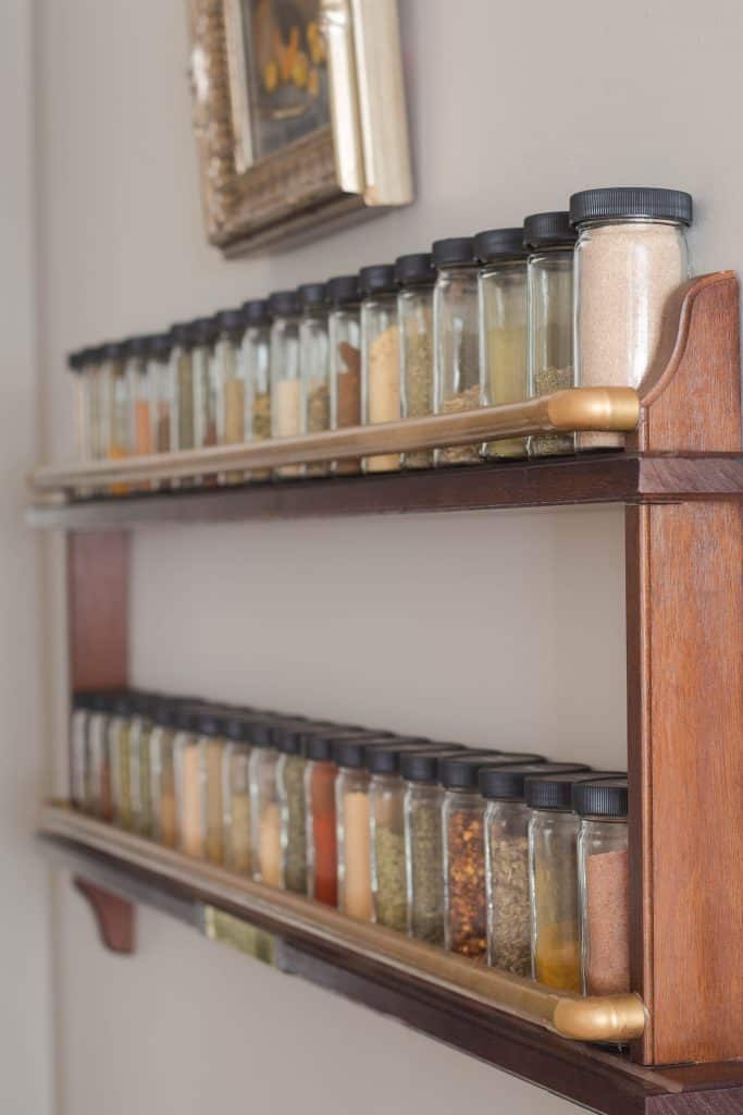 DIY Wall Spice Rack Made with a Thrifted Plate Rack Savvy Apron