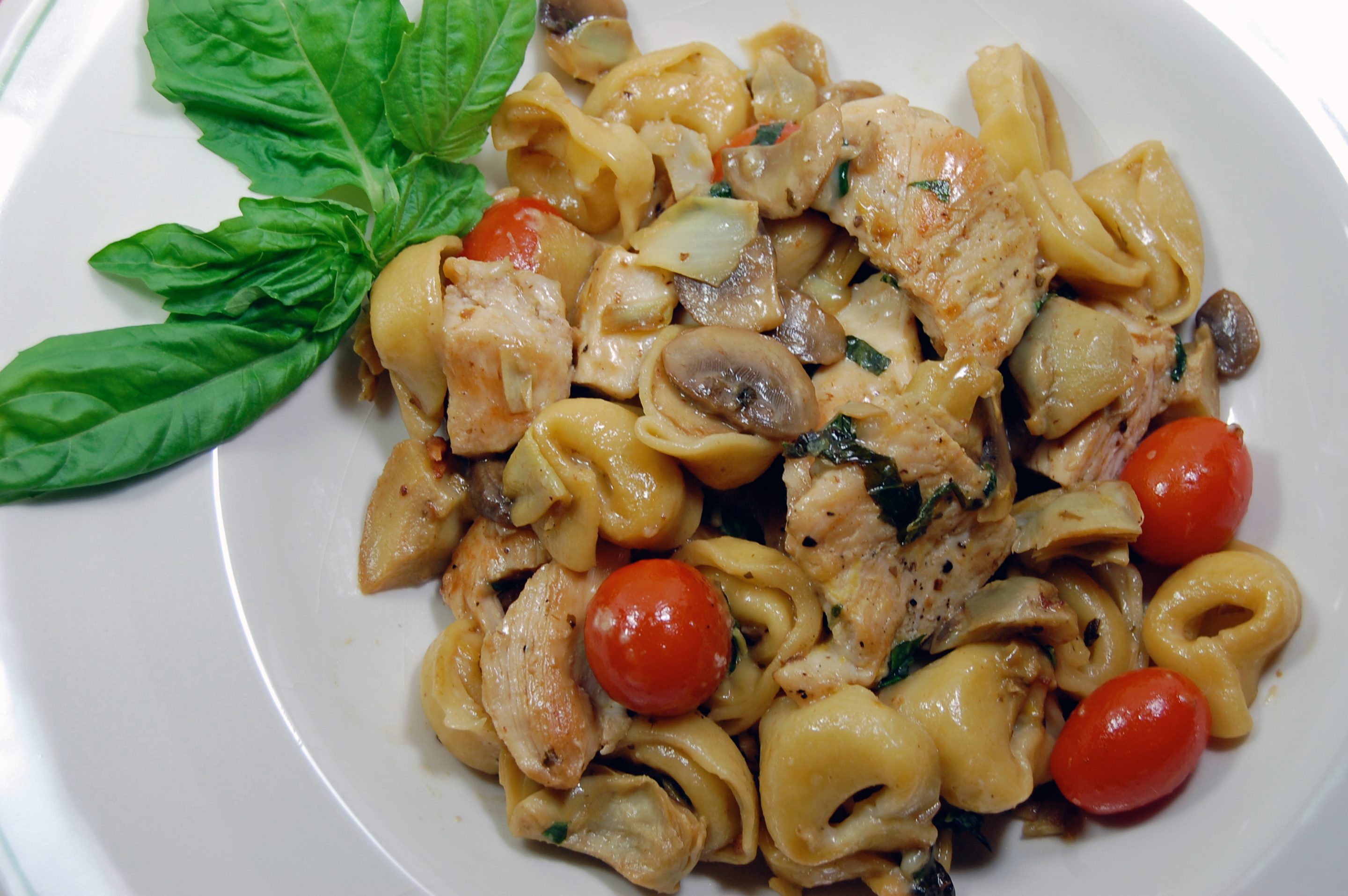Chicken, Mushrooms and Artichoke Hearts with Cheese Tortellini in a Light Lemon Butter Sauce