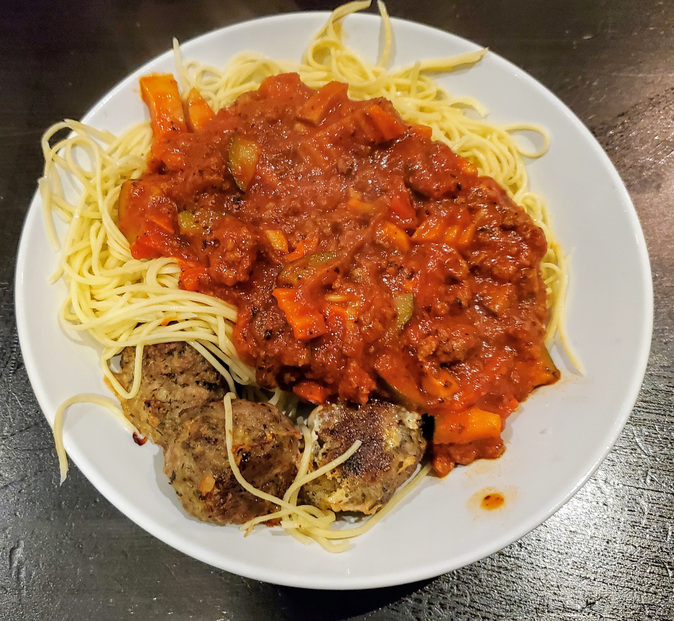 spaghetti and meatballs in a bowl