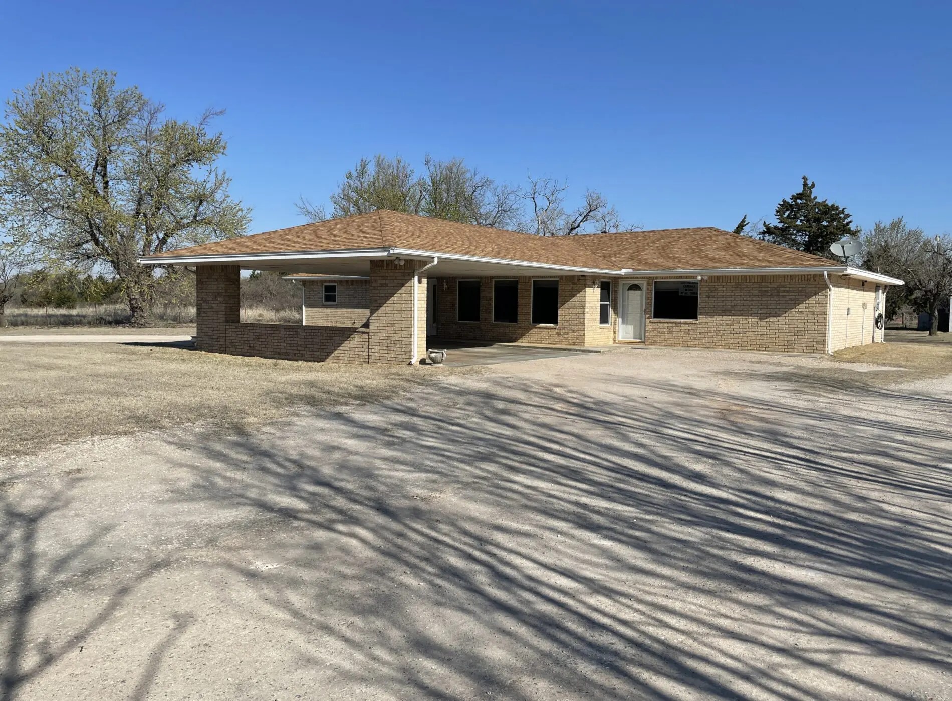 Brick home on 12.59 acres in Mooreland! Smith & Co Auction and Realty