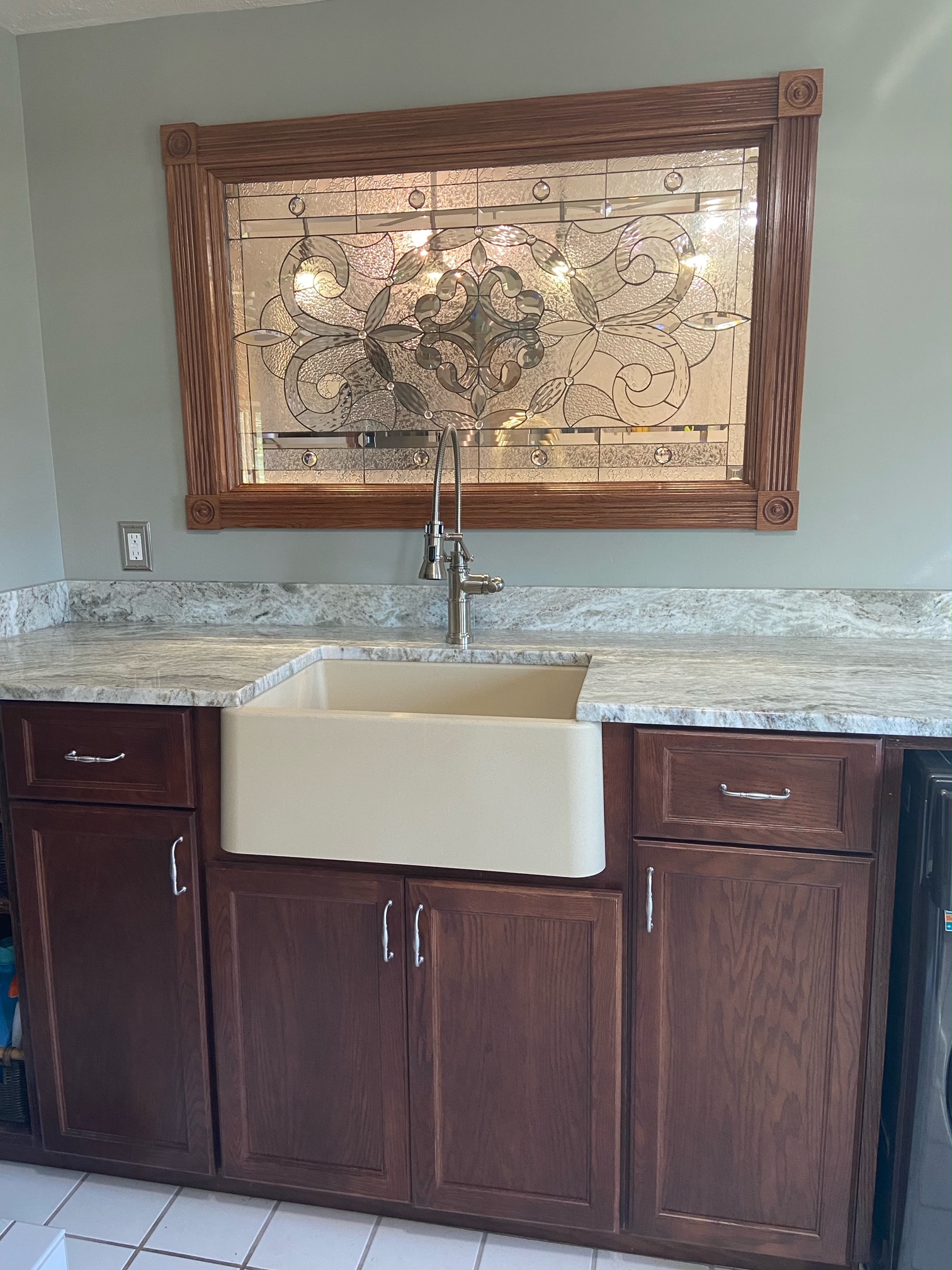 Clear and Beveled Stained Glass installed behind a kitchen sink
