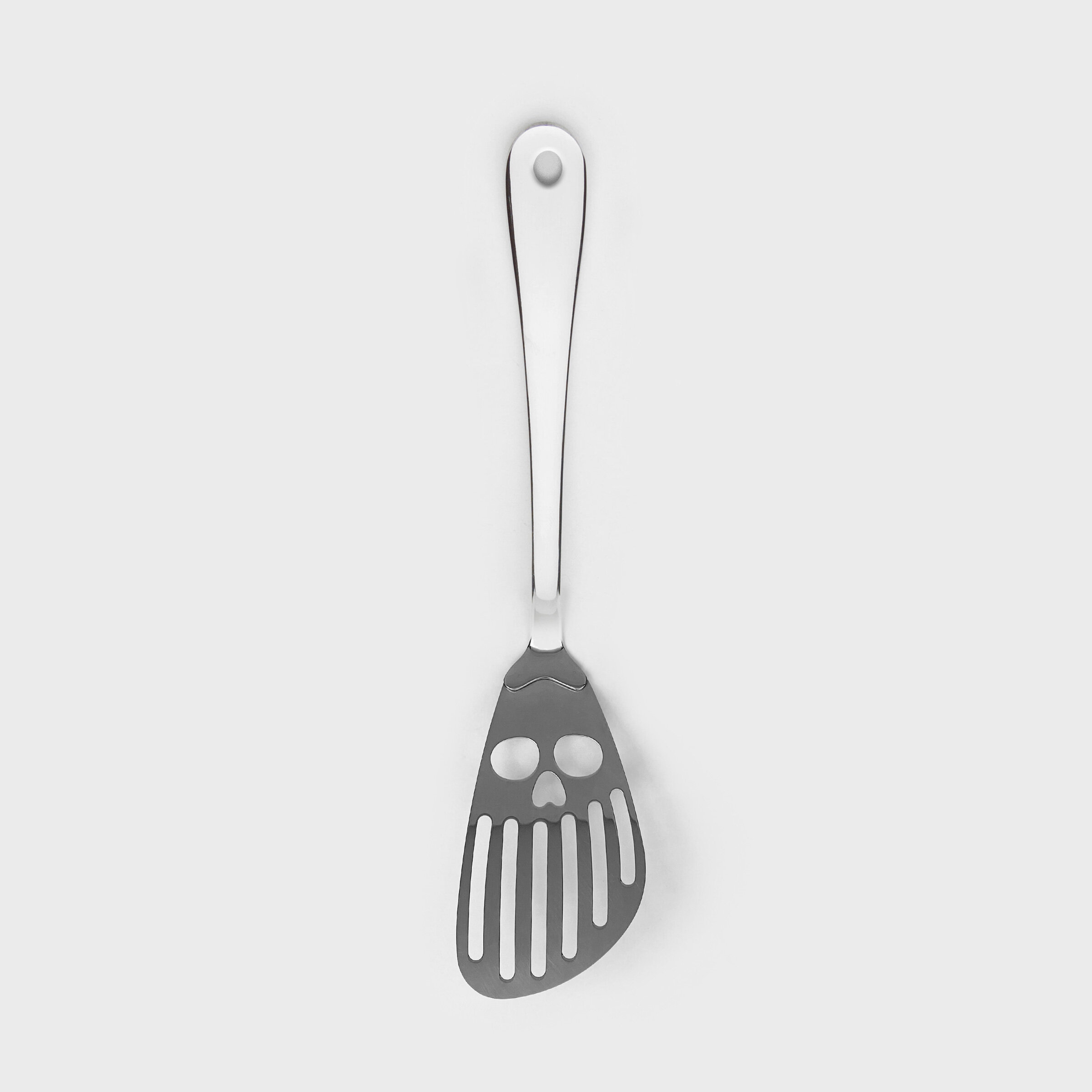 Skull Kitchen Spatula Skull faced stainless steel cooking utensil.
