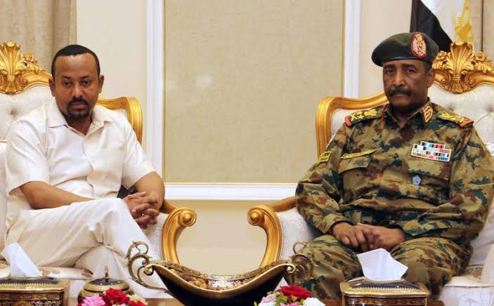 Ethiopian Prime Minister Abiy Ahmed (L) meets with the head of Sudan’s ruling Military Council General Abdel Fattah al-Burhan (R), in Khartoum, June 7, 2019 [Photo by AFP]