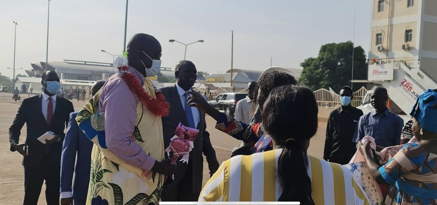 South Sudan’s foreign minister Mayiik Ayii Deng being welcomed at Juba airport upon return from Qatar. [Photo by the ministry of foreign affairs]