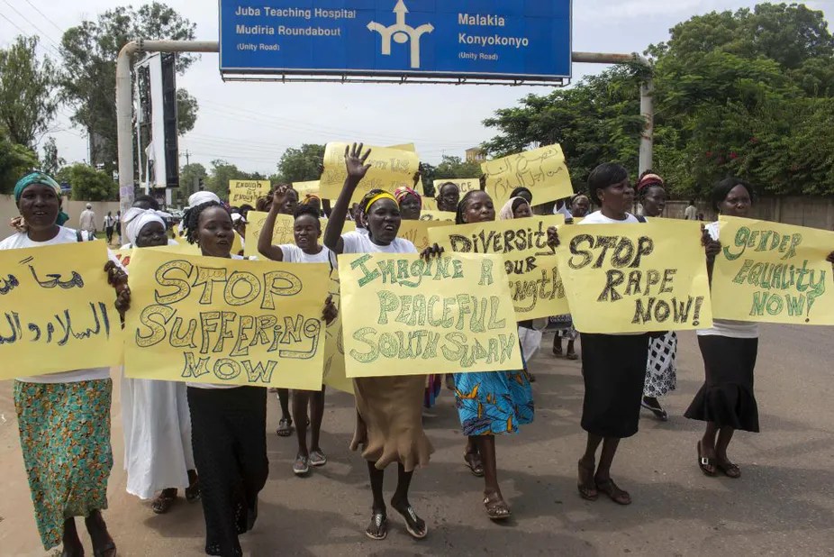 Women march with placards calling for peace and their rights on the streets of South Sudan’s capital, Juba, in 2018. [Photo by BULLEN CHOL/AFP via Getty Images]
