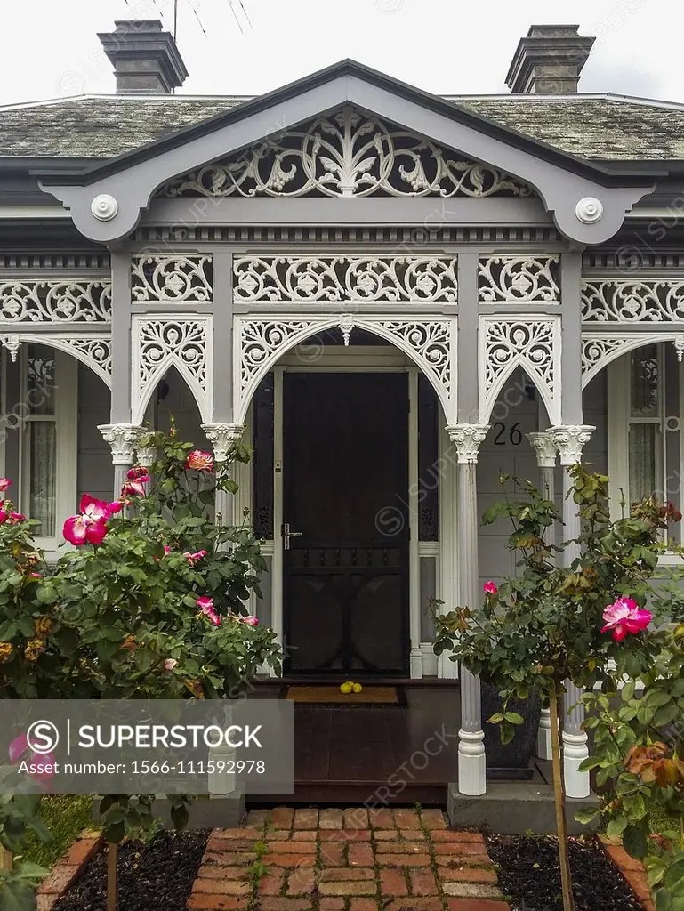 Intricate wrought iron lacework adorns the verandah of a Late Victorian