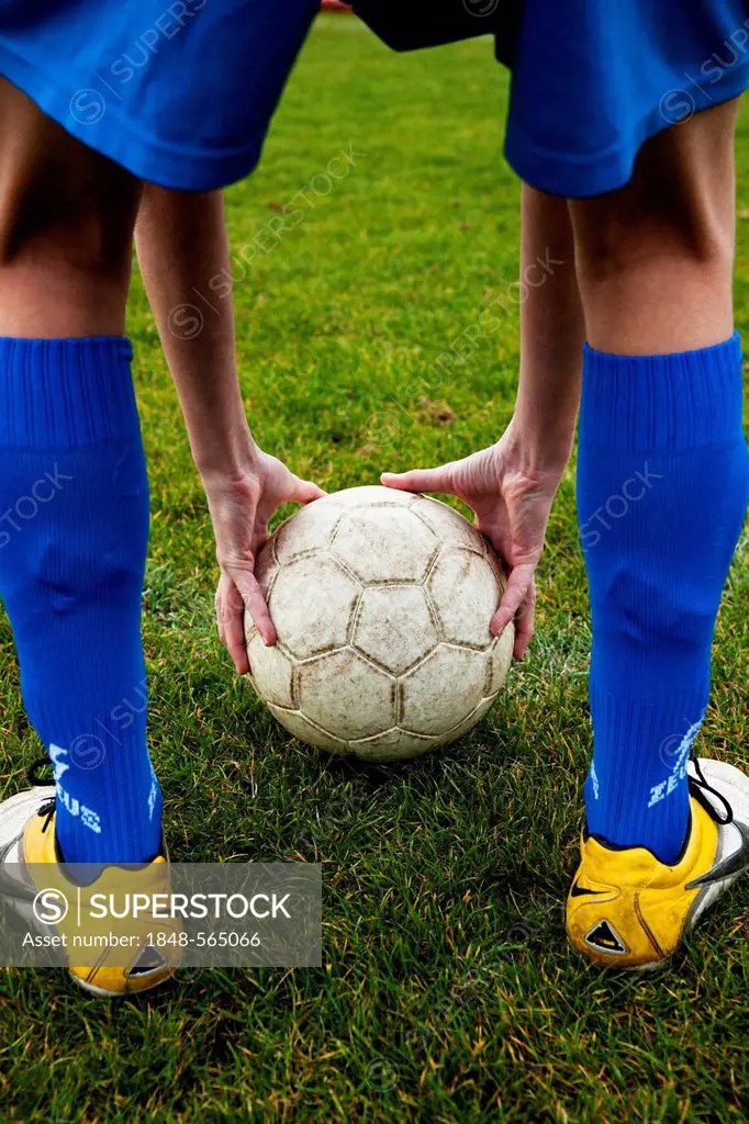 Soccer player positioning ball, soccer training SuperStock